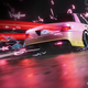 Screenshot of a race in NFS Unbound between a Mercedes sedan and new Porsche 911